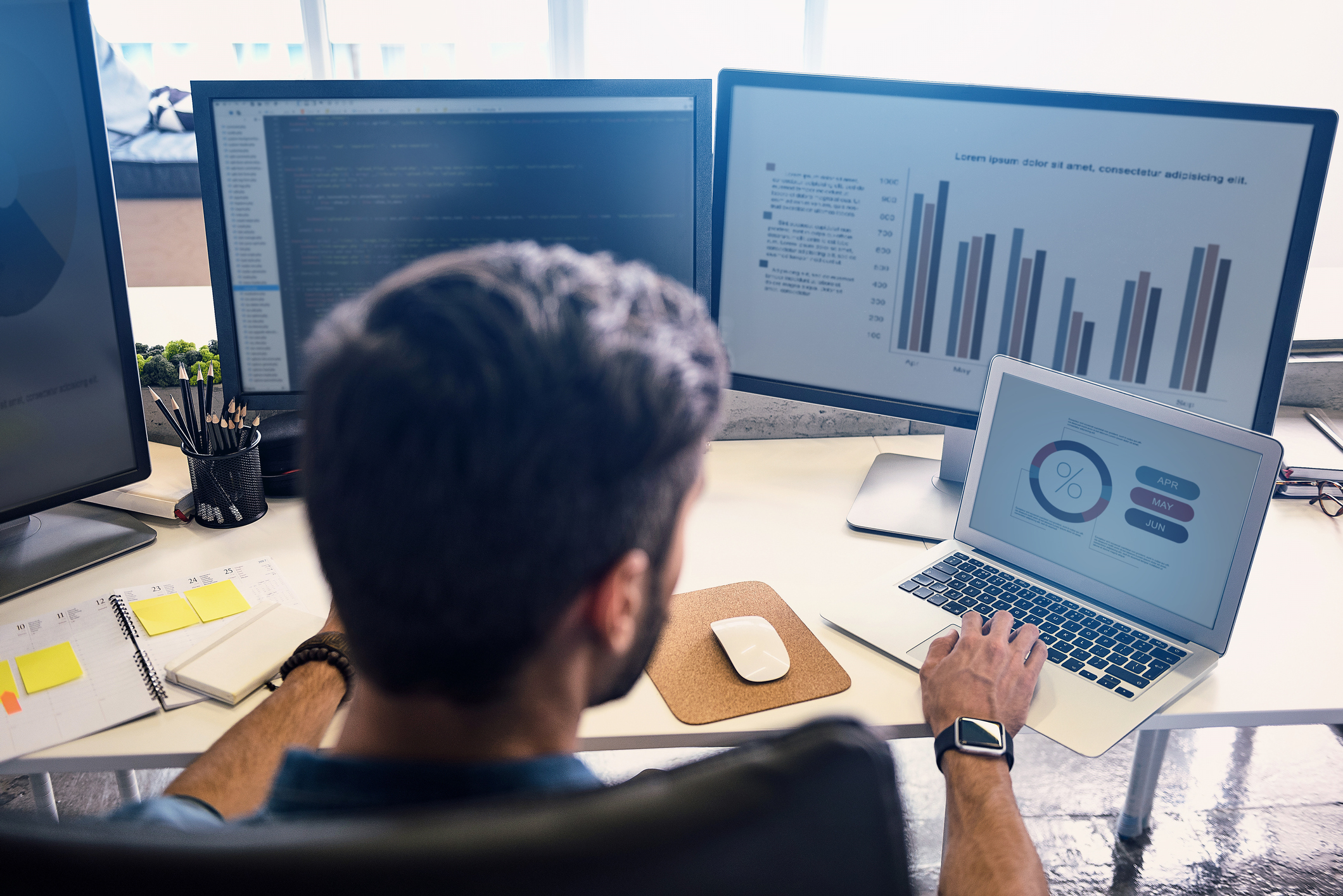 Property manager using software to monitor properties on his computers