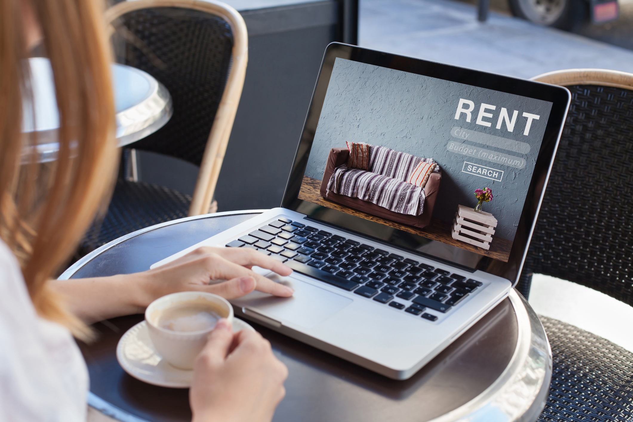 Woman using an online rental portal to pay her rent